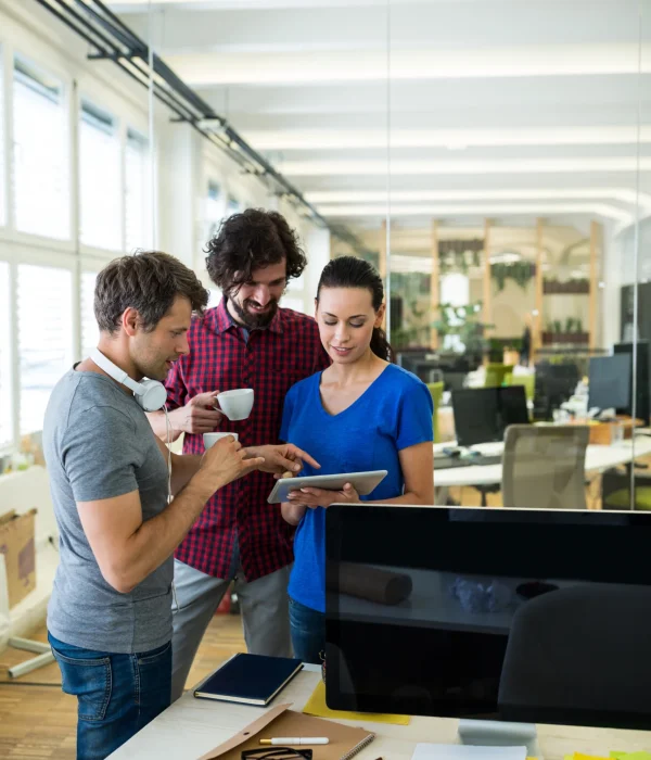 group-graphics-designers-using-digital-tablet-while-having-coffee